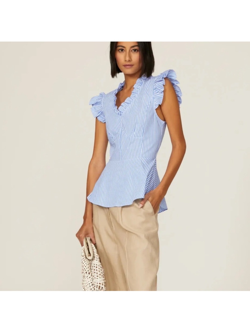 TOME
Flutter Sleeve Top